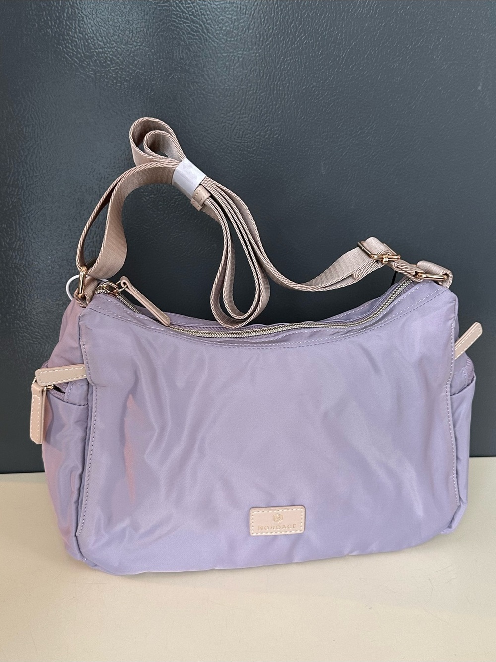 Lavender Crossbody Bag with Beige Trim by NORDACE SIENA